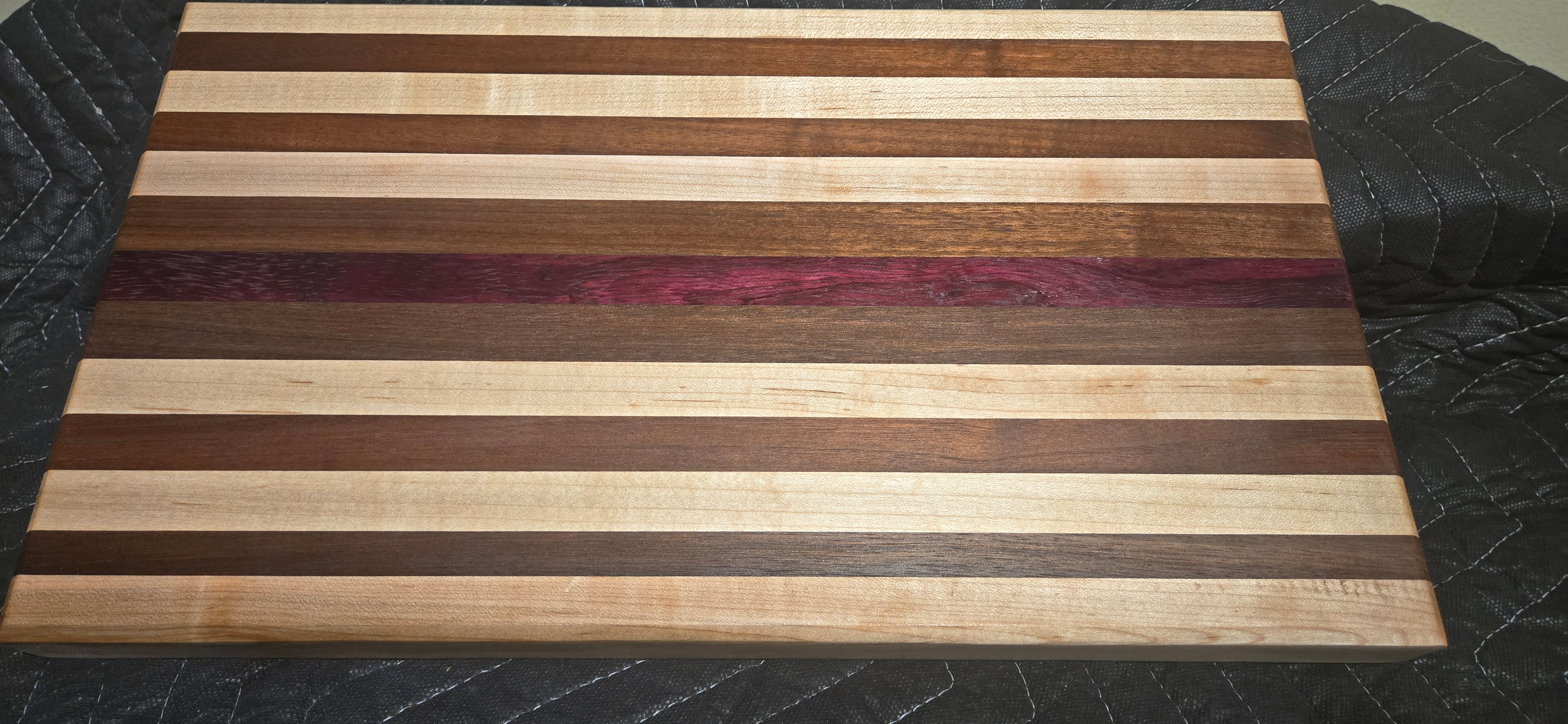 Maple, walnut,  purpleheart cutting board